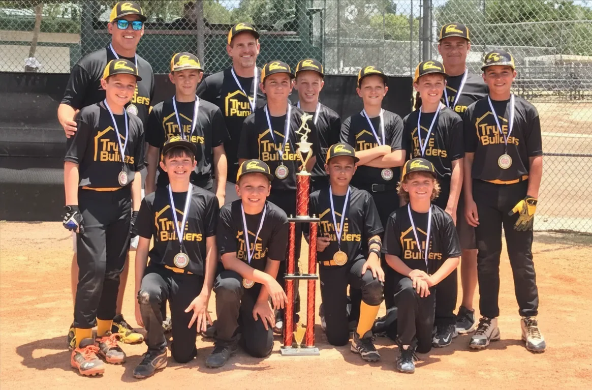 True-sponsored youth baseball team with coaches after a win in Central Florida